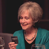 Elderly lady picking up Question Card