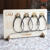 MyIntent card board holding 4 MyIntent bracelets