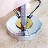 Person aligning their letter metal stamp on their bracelet token on the MyIntent Metal Stamping Base