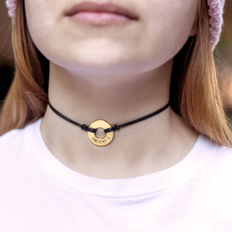 A girl wearing her MyIntent Custom Adjustable Necklace with Double Black Strings & Gold Plated Token