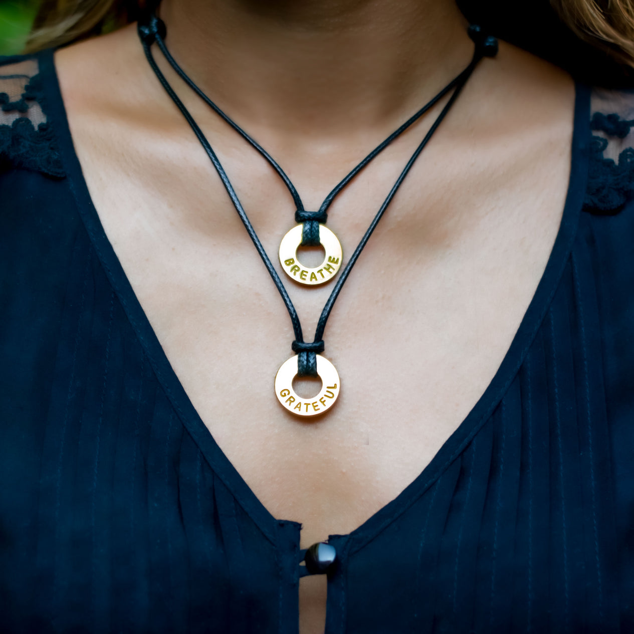 A girl wearing her Custom Adjustable Black Necklaces with the words BREATHE & GRATEFUL