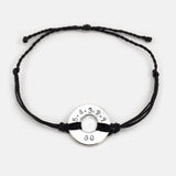 Mel Robbins' signature Twist Bracelet Black String Silver Token with the message 5.4.3.2.1.GO!