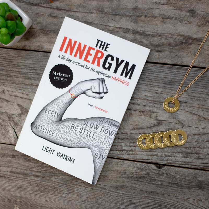 The Inner Gym book with a MyIntent brass chain necklace with 6 tokens each with an own unique word