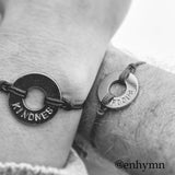 A couple with matching MyIntent Custom Classic Bracelets Black String with words KINDNESS & FOCUS 