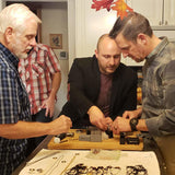 A couple of guys making bracelets using their MyIntent Maker Kit